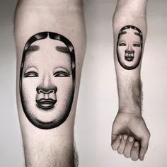 two people with faces tattooed on their legs, one is holding the other's hand