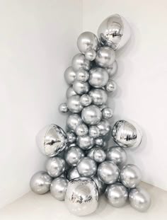 a christmas tree made out of silver balls