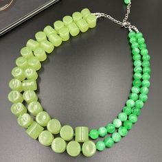 This beautiful Neon and Forest Green Statement Necklace is completely handmade with high quality. It can be worn with everything and everywhere, at a holiday party or after work with friends! This is a handcrafted necklace, uniquely designed with attention to every detail. - Necklace length is 18" shortest strand plus additional 4 inch extender chain for length adjustment. Matching earrings are available. Select from the option drop-down menu "necklace + earrings" to get the earrings with the necklace. Made from acrylic beads. - silver plated finding - clasp is stainless steel lobster claw - 4 inches extender is non tarnish silver plated textured chain This necklace would be a PERFECT GIFT for you or for your family and friends!   Click here to see more Necklaces: https://etsy.me/2ACTWK2 C Green Statement Necklace, Autumn Necklace, Green Beaded Necklace, Christmas Necklace, Tarnished Silver, Necklace Chunky, Handcrafted Necklace, Halloween Jewelry, Handmade Necklace