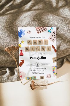 a game night party is set up on a bed with the name game night printed on it