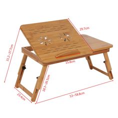 a wooden folding table with holes in the middle and two legs on each side, showing measurements