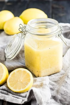 lemon salad dressing in a mason jar with sliced lemons around it and text overlay that reads, lemon salad dressing have ingredient healthy ingredients vegan whole