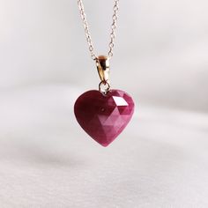 This stunning heart pendant is set in 14k Solid Yellow Gold with Natural Ruby with utmost precision. It is an unique gemstone pendant for nearly every occasion and is completely hassle-free jewelry. 🔷 ABOUT GEMSTONE: Ruby is a striking gemstone, revered for its vibrant red hue, symbolizing passion, love, and vitality. Known for its powerful energy, Ruby is believed to enhance courage, confidence, and self-empowerment. This gemstone is often associated with the heart chakra, promoting emotional 14k Gold Heart Necklace With Gemstone, Valentine's Day Yellow Gold Gemstone Heart Necklace, Valentine's Day Yellow Gold Heart Gemstone Necklace, 14k Gold Heart Cut Gemstone Necklace, Fine Ruby Heart-shaped Jewelry, Fine Ruby Heart Jewelry, 14k Gold Gemstone Heart Necklace For Anniversary, 14k Gold Gemstone Heart Necklace For Valentine's Day, Heart-shaped Ruby Gemstone Necklace