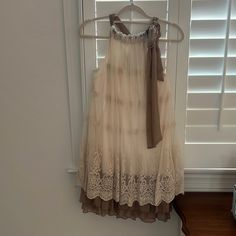 Lace Boutique Dress. New With Tags. Size Small. Dressy Beige Sleeveless Dress, Dressy Beige Midi Dress For Summer, Beige Dressy Midi Dress For Summer, Beige Lace Trim Sundress, Flowy Beige Dress With Lace Trim, Brown Lace Trim Dress For Spring, Spring Party Dress In Neutral Color, Spring Neutral Party Dress, Beige Flowy Mini Dress For Garden Party