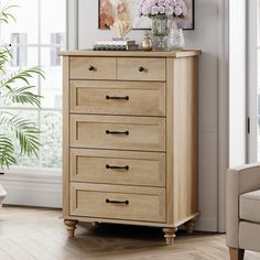 a wooden chest of drawers in a living room