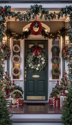 christmas wreaths on the front door of a house