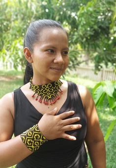 A beautiful tribal set of bracelet and necklace in shipibo icaros patterns worn by a Shipiba in her village. im selling the set as a complete here but you can also choose the necklace or bracelet seperately in other listings. Fair Trade Bracelet Jewelry For Festivals, Fair Trade Festival Bracelet Jewelry, Artisan Black Beads Jewelry For Festivals, Artisan Black Beaded Jewelry For Festivals, Handmade Artisan Black Choker, Traditional Adjustable Black Beads Choker, Black Artisan Handmade Choker, Traditional Adjustable Fair Trade Jewelry, Adjustable Black Handwoven Necklace