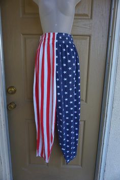 Vintage 90s stars and stripes print baggy pants. Labeled size Large. Two side pockets. Great vintage condition. please see measurementsMeasurements taken across front laid flatstretches from 15" to 20" across front of waist40" length32" inseam Patriotic American Flag Print Bottoms, Patriotic Cotton Bottoms For 4th Of July, Patriotic American Flag Print Blue Bottoms, American Flag Print Cotton Bottoms For Memorial Day, American Flag Cotton Bottoms For Memorial Day, American Flag Cotton Bottoms For 4th Of July, Patriotic American Flag Print Cotton Bottoms, Patriotic Flag Print Bottoms For 4th Of July, Blue Patriotic Bottoms With American Flag