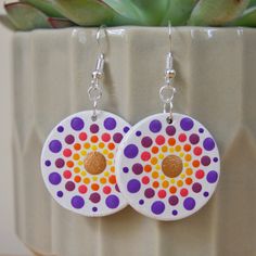 Hand painted dot mandala earrings 3cm diameter circle pendants hanging on earring hooks Painted on front side - purple, pink, yellow, orange, bronze Solid single colour on back - white (same as background on front) Pendants; wood, acrylic paint, satin varnish Fixing; silver plated Any questions please don't hesitate to drop me a message :) (all earrings are hand painted therefore are not be perfectly symmetrical) Mandala Earrings, Violet Rose, Jaune Orange, Dot Mandala, Wood Acrylic, Mandala Dots, Earring Hooks, Dot Painting, Circle Pendant