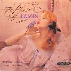 an advert for the perfumes of paris featuring a woman with red hair and a bird on her shoulder