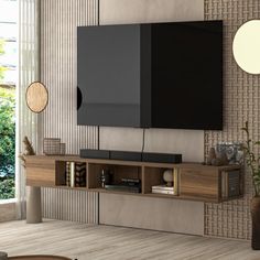 a living room with a large flat screen tv mounted to the side of a wall