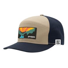 Celebrate the outdoors life with this playful, colorful rendering of the GRZ and the FSH at river's edge on a beautiful summer morning in the backcountry. This premium five panel cap features an extra wide patch showcasing the spirit of GrizzlyFish backcountry: predator, prey, natural solitude and brilliant color all wrapped in a super sweet hat. Wear it on the water, in the woods, around town, on the road or anywhere you won't mind receiving compliments on your headwear! Features: Structured hi 7 Panel Hat, Navy Baseball Cap With Flat Bill For Outdoor, Navy Snapback Hat With Curved Brim For Outdoor, Navy Flat Bill Baseball Cap For Outdoor, Blue Summer Hiking Hat, Navy Six-panel Outdoor Hat, Navy Baseball Cap For Summer Outdoor, 5-panel Hats For Outdoor Activities In Summer, Navy Six-panel Snapback Hat For Outdoor