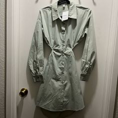 Nwt Cutout Shirt Dress Forever 21 Size Small Color Sage Green A Poplin Shirt Dress Featuring A Basic Collar, Dropped Shoulders, Long Sleeves With Buttoned Cuffs, Button-Down Front, Dramatic Side And Back Cutout, Centered Self-Tie Backstrap, And A Curved Hem. Content + Care - 100% Cotton - Machine Wash Cold - Measured From A Size Small - Full Length: 33.25" - Chest: 17" - Waist: 13" - Sleeve Length: 20 Dropped Shoulders, Long Sleeves With Buttoned Cuffs, Button Down Front And Back Cutout, Centere Cotton Long Sleeve Mini Dress For Date Night, Forever 21 Long Sleeve Trendy Mini Dress, Cotton Mini Shirt Dress For Brunch, Forever 21 Long Sleeve Mini Dress For Day Out, Forever 21 Long Sleeve Dresses For Spring, Forever 21 Long Sleeve Mini Dress For Brunch, Forever 21 Fitted Button-up Dress, Forever 21 Button-up Dresses, Forever 21 Button-up Dress For Day Out