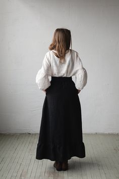 Victorian style inspired long skirt is made from 100% soft and washed linen. Wear it with belt or without. Match it with our tunics! Details: - Composition: 100% Oeko-Tex certified linen - Colour: black - Ruffled skirt - Comes with the belt - Pockets - Elastic waist - Medium weight linen - Linen care: machine wash gentle; tumble dry low, ironing optional - The price is for one skirt, other pictured items are not included Long Black Tiered Skirt Outfit, Fitted Linen Wrap Skirt With Lining, Fitted Linen Tiered Skirt, Bohemian Linen Relaxed Skirt Bottoms, Fitted Linen Maxi Skirt, Bohemian Linen Bottoms With Relaxed Skirt, Bohemian Linen Bottoms With Relaxed Skirt Fit, Bohemian Linen Skirt, Peasant Style Relaxed Skirt