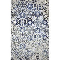 a blue and white rug with an intricate design