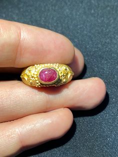 A beautiful gold ring from south east Asia very good condition A beautiful small Ruby light stone is placed in this gold ring The weight of the ring is 4.62 grams we can provide gold certificate as well on request of customers The percentage of gold of this ring is 75 percent which means 18 karat gold we provide fast and free shipping to our customers by which can get the items by maximum 7 working days Ancient Gold Ring, Beautiful Gold Rings, Gold Certificate, South East Asia, Carnelian Beads, Agate Bracelet, East Asia, Ancient Chinese, Photo Bracelet