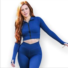 Size S Zip Up Thumb Holes Blue Long Sleeve Activewear For Fall, Blue Stretchy Activewear For Fall, Blue Stretch Activewear For Fall, Blue Stretch Long Sleeve Activewear, Blue Long Sleeve Stretch Activewear, Blue Stretch Athleisure Outerwear, Blue Spring Outerwear For Workout, Blue Spring Workout Outerwear, Spring Workout Blue Outerwear