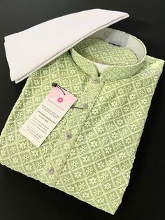 Parrot Green Chikankari Work Men's Kurta Pajama Set with full Lucknowi embroidery work on the Kurta on the Front and back side of the Kurta. Kurta comes with a Soft Lining paired with white color cotton bottom/pajama.  Father-Son Kurtas - For Boys Kurta -  https://www.etsy.com/listing/1504101684/boys-parrot-green-chikankari-lucknowi?click_key=3863dfba142cd3bf281791847f638a4782d4cc24%3A1504101684&click_sum=f5e135de&ref=shop_home_active_1&frs=1&sts=1 Kurta is Fully Lined. Very trendy and Classy Lo Parrot Green Kurta For Men, Light Green Kurta For Men, Lukhnowi Kurta For Men, Lucknowi Embroidery, Men's Kurta Pajama, Mens Ethnic Wear, Chikankari Work, Men Kurta, Men's Kurta