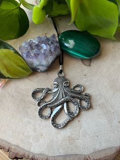 Octopus Pendant Necklace made out of comfortable way cord. Measures 17" length shortest. **All orders are free shipping over 35 **Orders are packaged safely in a black bubble mailer** Feel free to message for any questions Thankyou Sophia from SophieRei Designs Unique Silver Necklace With Adjustable Cord, Nickel-free Waxed Cord Necklace - Ideal Gift, Nickel-free Waxed Cord Necklace For Gifts, Unique Waxed Cord Necklace As Gift, Silver Waxed Cord Necklace For Gift, Silver Necklace With Waxed Cord For Gift, Waxed Cord Pendant Necklace Gift, Waxed Cord Jewelry With Round Pendant As Gift, Waxed Cord Jewelry With Round Pendant For Gift