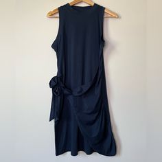 La Mode Navy Jersey Sleeveless Apron Wrap Dress Color: Navy 65% Cotton 35% Polyester Sleeveless Mini Dress With Tie Waist For Daywear, Sleeveless Blue Midi Dress With Tie Waist, Sleeveless Maxi Dress With Tie Waist, Sleeveless Maxi Dress With Tie Waist For Daywear, Sleeveless Apron, Ethereal Style, Mode Dress, Velvet Cocktail Dress, Blouson Dress