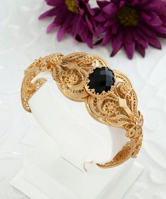 Gold Black Spinel Silver Boho Bangle Cuff Bracelet, 925 Sterling Silver 18K Gold Plated, Artisan Handmade Filigree Edwardian Bangle Cuff Black stone cuff, silver gift for mom her, gold statement cuff, one of a kind cuff, bold cuff bracelet, anniversary gift her, wedding gift her, vintage ornate cuff Material: 925 Sterling Silver 18K Gold Plated ( NICKEL FREE ) Gemstone: Black Spinel  12x16 mm. Black Spinel is valued for its elegant appearance and affordability in comparison to other black gemstones. In addition to its aesthetic appeal, some people believe in its metaphysical properties, associating it with energy renewal, grounding, protection, and emotional healing. Whether appreciated for its beauty, durability, or spiritual significance, Black Spinel continues to captivate jewelry enthu Luxury Adjustable Cuff Bracelet With Intricate Design, Elegant Cuff Bracelet With Intricate Design For Formal Events, Elegant Cuff Bracelet With Intricate Design For Formal Occasions, Luxury Filigree Round Bracelets, Adjustable Luxury Bracelets With Intricate Design, Luxury Adjustable Bracelets With Intricate Design, Elegant Gold Cuff Bracelet For Ceremonial Use, Elegant Hallmarked Cuff Bracelet Bangle, Elegant Gold Filigree Bracelet