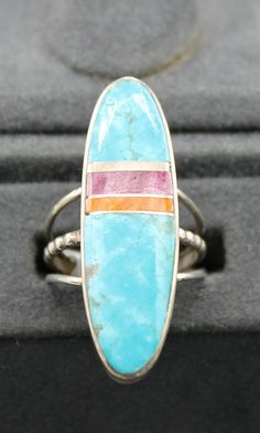 Kingman Turquoise,  Spiny Oyster and Sterling Silver Ring Size 6 features the range of colors spiny oyster has and stone setting measures 1 3/8" long and 3/8" wide Collectible Blue Multi-stone Turquoise Ring, Collectible Multi-stone Blue Turquoise Ring, Unique Blue Turquoise Multi-stone Ring, Southwestern Multi-stone Turquoise Ring, Southwestern Multicolor Gemstone Turquoise Ring, Southwestern Multicolor Turquoise Gemstone Ring, Adjustable Multicolor Multi-stone Turquoise Ring, Adjustable Multi-stone Turquoise Ring, Oval Multicolor Turquoise Ring With Natural Stones