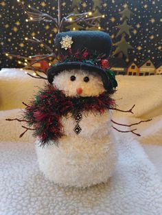 a snowman with a hat and scarf on