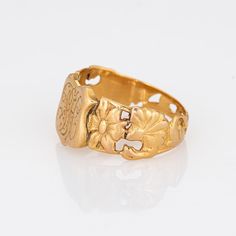 Finely detailed antique Victorian shield signet ring (circa 1880s to 1900s), crafted in 18 karat yellow gold.   The centre shield is engraved with the initials "FH".   The side shoulders feature a pretty floral design, terminating to the shield mount. The saddle of the ring is low and curves to the shape of the finger.     The ring is in good condition with patina and wear evident. We have not cleaned the ring in order to preserve the patina and collector value.    Particulars:  Weight: 6.6 gram Gold Shield, The Shield, Antique Victorian, Signet Ring, Initials, Floral Design, 18k Gold, Monogram, Yellow Gold