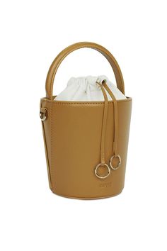 This CAFUNE Mustard Mini Bucket Basket, is probably the most structured bucket bag in the market, its cylindrical shape ensures a roomy interior. Wear it on your shoulder, cross-body, by the top handle or loop it in your arm.COLORMustardCOMPOSITION100% Italian Leather, Lining 100% Canvas DETAILS Drawstring top closure in canvas Cylindrical shapeDetachable adjustable strapBeige cotton lining Gold hardwareDIMENSIONS19 x 14 x 14 cm (H x W x D)0.35 kg (Weight)9.5 cm (Handle Drop)48-54 cm (Shoulder D Mini Basket, Mini Bucket Bags, Mini Bucket, Drawstring Top, Small Leather Goods, Silk Scarves, Leather Goods, Leather Accessories, Italian Leather