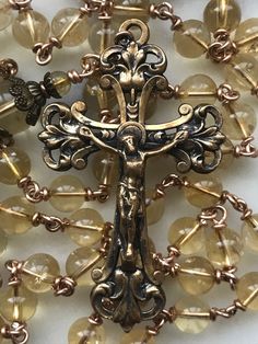 the cross is surrounded by many beads