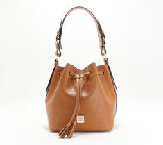 Crafted of luxe Saffiano leather, this drawstring bucket bag is a classic piece that you'll wear for seasons to come. From Dooney & Bourke. Luxury Bucket Bag For Fall, For Seasons, Drawstring Bucket Bag, Leather Bucket Bag, Leather Bucket, Dooney & Bourke, Hobo Handbags, Dooney Bourke, Fashion Handbags