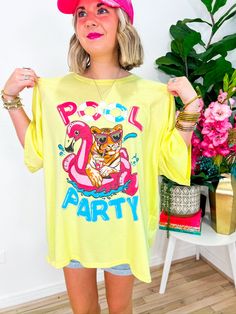 Dive into summer vibes with our Pool Party Tee! Embrace the oversized comfort adorned with a playful pool party-inspired print on the front, accentuated by dazzling rhinestone trim detailing. Whether it's a beach day or poolside lounging, this tee is your ultimate go-to, doubling as a chic swimsuit cover-up. PRODUCT FIT - OVERSIZED FIT MODEL DETAILS - BRENNA IS A SIZE SMALL, 5'3" FABRIC CONTENT - 100% COTTON CARE INSTRUCTIONS - HAND WASH COLD LAY FLAT TO DRY *PICTURES ARE EDITED TO ENHANCE COLOR Playful Graphic Print Swimwear, Casual Swimwear For Summer Parties And Vacation, Casual Swimwear For Summer Vacation Parties, Printed Yellow T-shirt For Vacation, Yellow Printed T-shirt For Vacation, Fun Cotton Swimwear For Poolside, Casual Summer Pool Tops, Casual Summer Tops For Pool, Casual Summer Party Tops