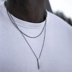 Introducing the EFFENTII Vertika Pendant - The Ultimate Statement Piece Bask in the majesty of our EFFENTII Vertika Pendant Men's Necklace. This artistic masterpiece effortlessly marries dual rope link chains with a sleek and glittering vertical pendant. A beacon of style that shines brightly, drawing the eye and garnering admiration wherever you go. A Timeless Symbol in a Modern Aesthetic Inspired by the mystique of an obelisk, the Vertika pendant exudes balance and grace, hanging perfectly fro Minimal Bar, Bar Necklaces, Mens Necklace Pendant, Necklaces For Men, Vertical Bar Necklace, Layered Chain Necklace, Vertical Bar, Gold Rope Chains, Mens Chain Necklace