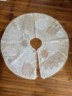 a white doily on a wooden floor