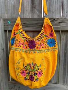 "Super Cute Floral Embroidered Bag from Puebla, Mexico Overview *Thread material * Cotton Fabric *approximate measurements: 13\" from bottom to zipper area & 15-16 with if expanded *handmade *Design colors may vary per purse as all are embroidered with unique colors * Closure is zipper or magnetic button - you can specify in notes section @ checkout which one you prefer * One pocket inside Care *hand wash only *delicate care *hang dry Please email me your questions before buying. All of my i Embroidered Satchel Shoulder Bag For Summer, Everyday Embroidered Hobo Shoulder Bag, Embroidered Hobo Shoulder Bag For Everyday Use, Yellow Embroidered Bag For Daily Use, Embroidered Satchel Hobo Bag For Daily Use, Bohemian Cotton Bag With Floral Embroidery, Yellow Embroidered Tote Bag, Cotton Bags With Multicolor Embroidery, Bohemian Cotton Bags With Floral Embroidery