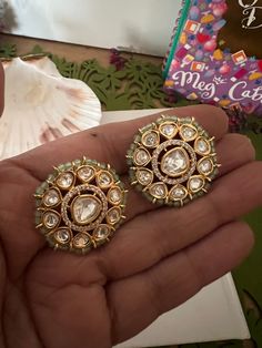 Restocked ♥️ On popular demand  This gorgeous Bridal Studs will add a perfect charm to your festive wear. One of our favorite picks for the wedding season  The diameter of the studs is 3cms. The weight of the studs is 12 grams per pair. Notice the zirconia stones bordering the center Kundan piece. Premium Quality Colour: Mint Green Bridal Earrings With Zari Work For Reception, Bridal Earrings With Zari Work For Diwali Reception, Gota Work Bridal Earrings For Reception And Festivals, Diwali Reception Bridal Earrings With Zari Work, Mirror Work Jhumkas For Reception Festivals, Wedding Bridal Earrings With Meenakari And American Diamond, American Diamond Bridal Earrings With Meenakari, Diwali Reception Chandbalis With Gota Work, Kundan Bridal Earrings With Zari Work For Reception