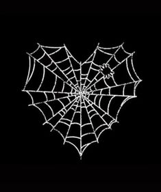 a spider web on a black background in the shape of a heart with an evil face