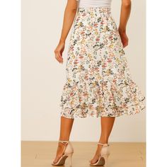 Featuring pretty ditsy floral prints, this midi skirt is a summer option that can be worn with just about anything. Channel elegant style in this midi skirt which is beautifully printed with a blossom pattern for a versatile look. It is made of lightweight fabric, adding definition to the free-flowing design. Falling to a waterfall midi hem, it sits high on the waist with a discreet side zip fastening. Summer days call for effortlessly feminine styles like skirts. Chic Printed Summer Skirt, Trendy Summer Midi Length Bottoms, Trendy Summer Midi Bottoms, Floral Print Summer Skirt, Printed Summer Skirt For Day Out, Summer Day Out Printed Skirt, Trendy Printed Summer Skirt, Summer Floral Print Tiered Skirt, Spring Floral Print Skirted Bottoms