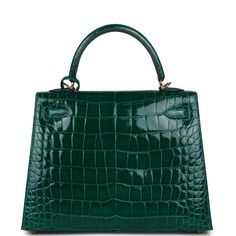 This Kelly 25, in the Sellier style, is in Emerald shiny Mississippiensis alligator with gold hardware and has tonal stitching, front flap, two straps with center toggle closure, clochette with lock and two keys, single rolled handle and removable strap.The interior is lined with Emerald chevre and has a zip pocket with an Hermes engraved zipper pull and two open pockets on the opposite side. Collection: AOrigin: FranceCondition: Pre-owned; Excellent to Mint -This bag retains its shape structure. There's partial plastic on the hardware. Moderate scratching to the turnlock hardware. Some minor creasing to exterior leather and small water spots on front exterior leather. The interior leather is clean with no signs of wear.Accompanied by: Hermes box, Hermes dustbag, clochette, lock, two keys, Hermes Special Order, Kelly Sellier, Hermes Box, Kelly Bag, Hermes Bags, Alligator, Gold Hardware, Zip Pockets, Dust Bag