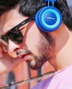 a man with sunglasses and headphones on