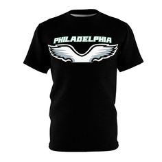 Our Philadelphia Eagles T-shirt is a stylish and comfortable option for devoted fans. This Cut and Sew Black T-shirt is designed to showcase your unwavering support for the Eagles while keeping you looking sharp. This Philly Teams Shirt is the perfect way to represent your love for Philadelphia football. This Game Day Shirt offers a soft feel and a relaxed fit, making it ideal for all-day wear. The cut-and-sew design provides a modern look that sets this shirt apart from the rest. With its short sleeves, this Football Shirt is perfect for layering or wearing on its own, ensuring you stay comfortable throughout the game. The bold Eagles graphic prominently displayed on the shirt is a fantastic way to show off your team spirit. This shirt is sure to catch the attention of everyone around you Philadelphia Eagles T Shirt, Shirt Football, Game Day Shirts, Team Shirts, Shirt Short Sleeve, Philadelphia Eagles, Football Shirt, Team Spirit, Football Shirts