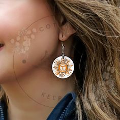 Showing off your Tennessee pride with these stylish Tennessee Volunteers logo earrings! Perfect for game day or everyday wear, these earrings are a must-have for any Tennessee football fan. Sport your team spirit in style with these eye-catching Rocky Top earrings. Add them to your cart now and elevate your game day look! ‼️See another pair of EARRINGS that you love? Enter promo code 2FOR16 to get $4 off your second pair! ‼️ HOW TO ORDER EARRINGS 1.) Please, Check and Review all Photos. 2.) Choose Your Quantity  3.) Click ADD TO CART. And, you can go back to add more products or You can complete the checkout process. 4.) Please Click "Proceed to Check Out" 5.) Finally, Your EARRINGS will be ready to ship 5-7 Business Days. Thanks for visiting my shop! Look for me on Facebook and Instagram Tennessee Game Day, Tennessee Logo, Rocky Top Tennessee, Top Earrings, Tennessee Football, Rocky Top, Tennessee Volunteers, Wedding Jewelry Earrings, Wedding Earrings