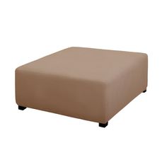 a brown ottoman sitting on top of a white floor