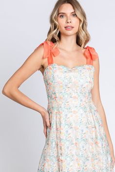 Lovelo by Gee Gee Beautiful classy embroidered sheer fabric midi dress with sweetheart neckline and self tie ribbon shoulder straps. Lined. Low back, zipper in the back. Absolutely beautiful! Color: Off White/Tangerine/Green Sizes: S-M-L Bust 32-34-36 85% Polyester, 15% Nylon, Lining 100% Rayon D1/MD50555 Spring Midi Dress With Sweetheart Neckline And Adjustable Straps, Spring Dress With Sweetheart Neckline And Tie Straps, Lace Dress With Tie Back And Sweetheart Neckline, Lace Mini Dress With Tie Straps, Mini Lace Dresses With Tie Straps, Spring Garden Party Midi Dress With Bow Straps, Square Neck Dress With Bow Straps For Brunch, Sweetheart Neckline Dress With Tie Back For Brunch, Summer Midi Dress With Sweetheart Neckline And Tie Back