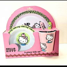 a hello kitty tableware set in a pink box with matching cups and saucers