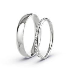 two white gold wedding rings with diamonds on each side, set in 18k white gold