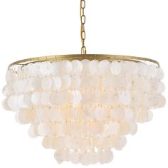 a large chandelier with white glass balls hanging from it's golden chain