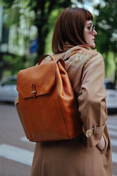 This handmade leather backpack is made with 100% natural full grain leather which is tanned with all natural materials. There is no chemical materials in this leather.  This backpack is handmade in our studio in Milan.  The backpack has one main compartment. There is One small zipped pocket in one side and one cellphone pocket in other side.  back side of the backpack has a outer pocket that has magnetic closure . All the bags will come with a cotton dust bag which can protect the leather and bag when it is not in use.  In options u can find Protection cream to add to your purchase. It will make the bag waterproof and will renew it after some use.  Dimensions :  Wide: 25.5 Cm / 10 inches Hight: 37.5 Cm / 14.7 inches  Deep: 11 Cm / 4.3 inches  it can hold up to 15' laptops Brown Travel Backpack With Smooth Grain, Travel Backpack With Smooth Grain In Brown, Brown Smooth Grain Travel Backpack, Brown Smooth Grain Standard Backpack, Brown Leather Backpack With Smooth Grain, Everyday Leather Backpack With Smooth Grain, Daily Use Leather Backpack With Smooth Grain, Everyday Backpack In Vegetable Tanned Leather, Everyday Backpack With Leather Lining And Vegetable Tanned Leather