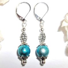 You Will Love The Color On These Gorgeous, Beaded Earrings. Handmade By Me - Wvluckygirl With Turquoise Blue Faux Pearl Glass Beads That Have A Drizzle Design On Them. They Have Antiqued Silver Toned Costume Jewelry Beads. The Pair Dangle And Drop From 925 Sterling Silver Lever Backs For Women's Pierced Ears. Measure 1 3/4 Inches Tall And Not Quite 3/8 Inches Wide. Each Single Earring Weighs 1.8 Grams. Lightweight! Buy Them Now Before Someone Else Does! Unique Colorful Funky Handcrafted Artisan Nickel-free Turquoise Jewelry For Parties, Turquoise Sterling Silver Jewelry For Party, Nickel-free Turquoise Earrings For Party, Blue Pearl Earrings, Pearl Earring Set, Fancy Dress Up, Pearl Earring, Jewelry Beads, Blue Pearl