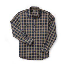 Ideal for work and everyday wear, our Wildwood Shirt is made of a breathable, pre-washed cotton twill for comfort and durability. A pleated back provides a full range of motion through the shoulders. Button front with button-adjustable cuffs for a custom fit. Two chest pockets hold pencils, tools, phones or other accessories. | Filson Wildwood Shirt Bronze/Navy Plaid Size XS Rugged Cotton Shirt, Unstructured Rugged Cotton Tops, Navy Cotton Shirt For Everyday, Relaxed Fit Cotton Flannel Shirt For Work, Outdoor Cotton Button-up Flannel Shirt, Classic Cotton Shirt For Outdoor, Rugged Cotton Button-up Tops, Rugged Long Sleeve Cotton Flannel Shirt, Rugged Unstructured Cotton Shirt